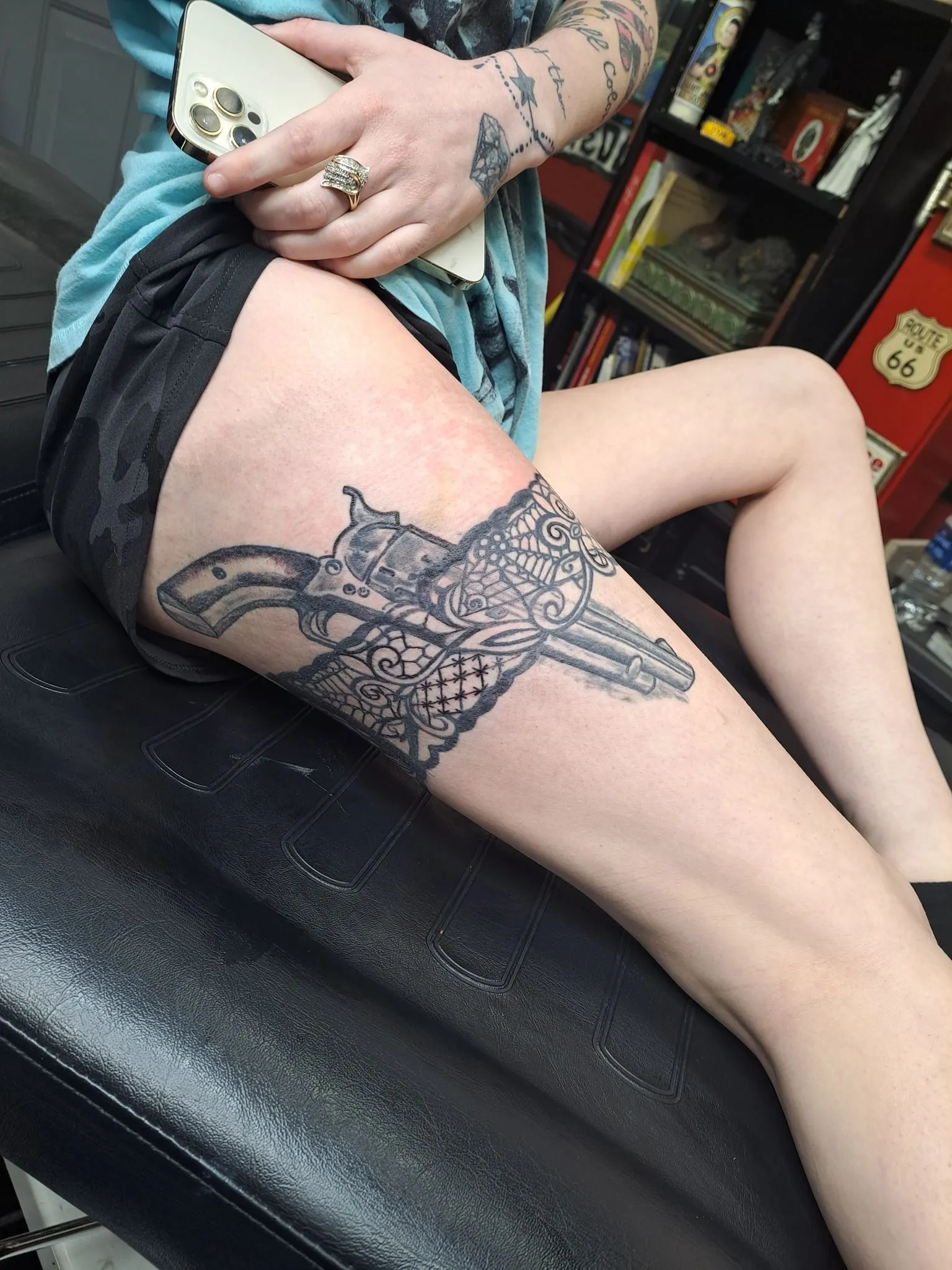 Traditional American revolver and mandala tattoo