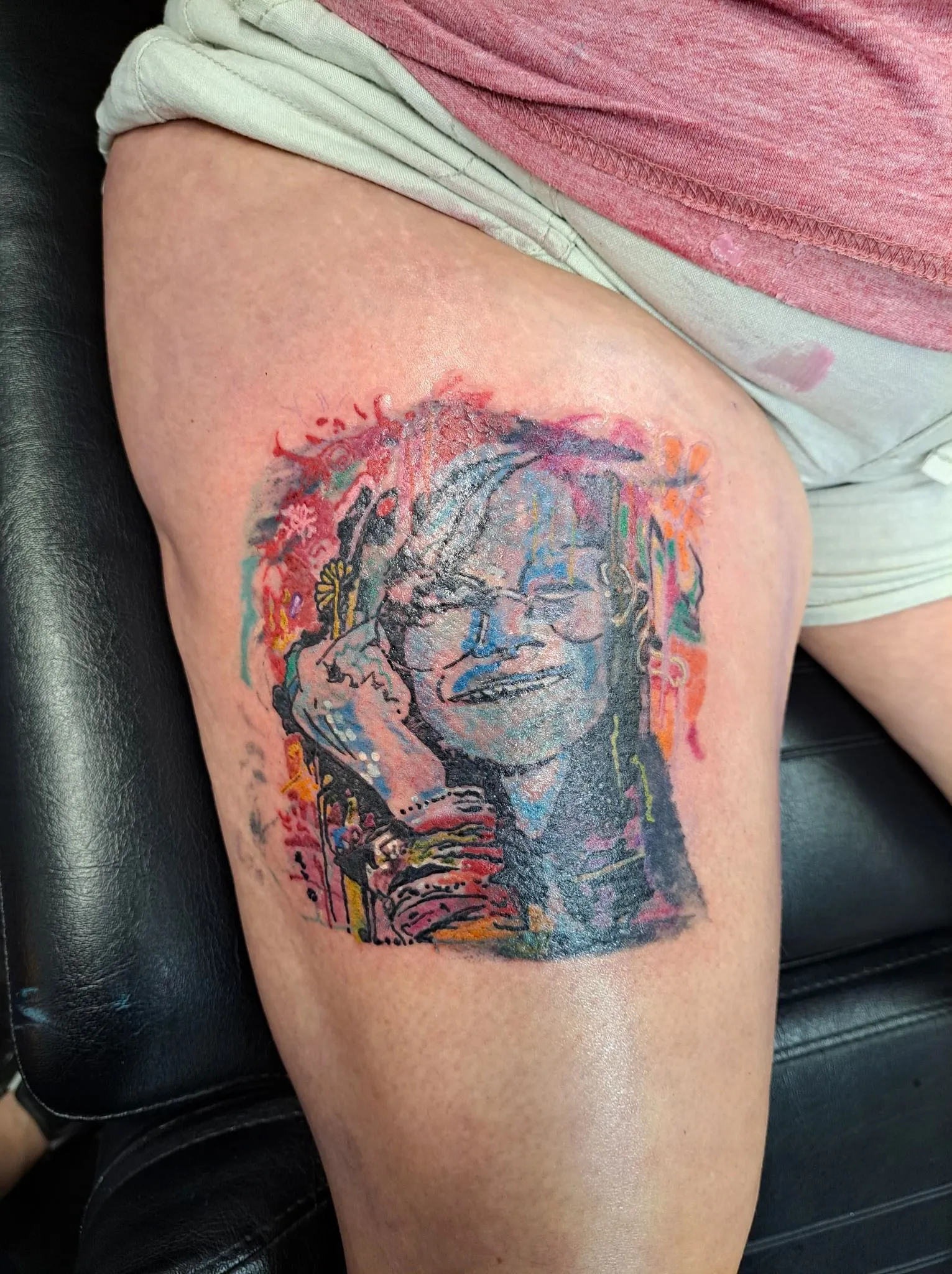 Colorful watercolor portrait tattoo
